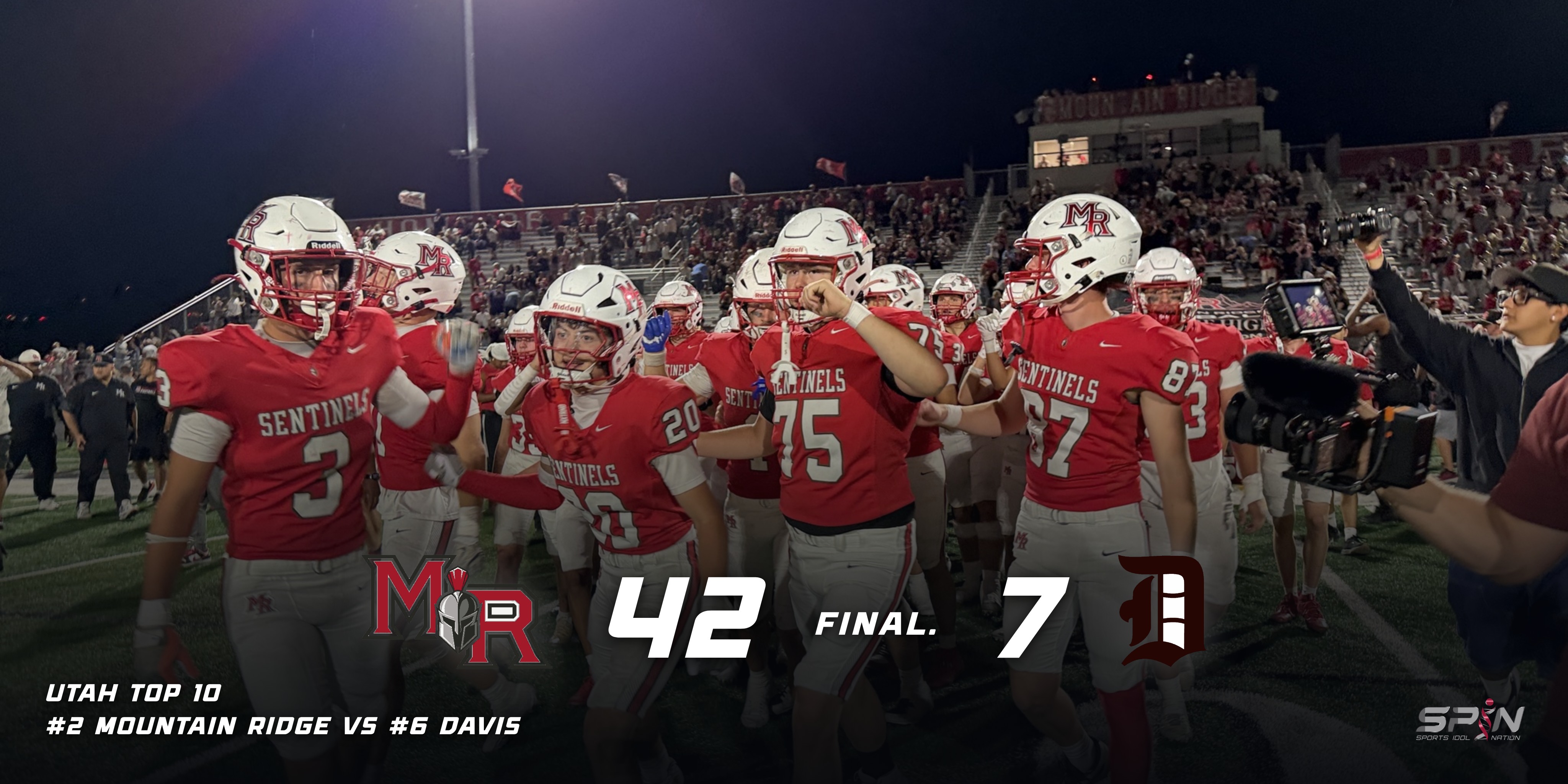 Mountain Ridge players in red Sentinels jerseys and white MR helmets walk off the field celebrating after beating Davis, with a full student section and the Mountain Ridge press box lit behind them and a television camera at the right. Across the bottom the Mountain Ridge and Davis school marks flank the score, which reads 42, FINAL, 7, above a line reading Utah Top 10, number 2 Mountain Ridge vs number 6 Davis, with the SPIN Sports Idol Nation mark at bottom right.